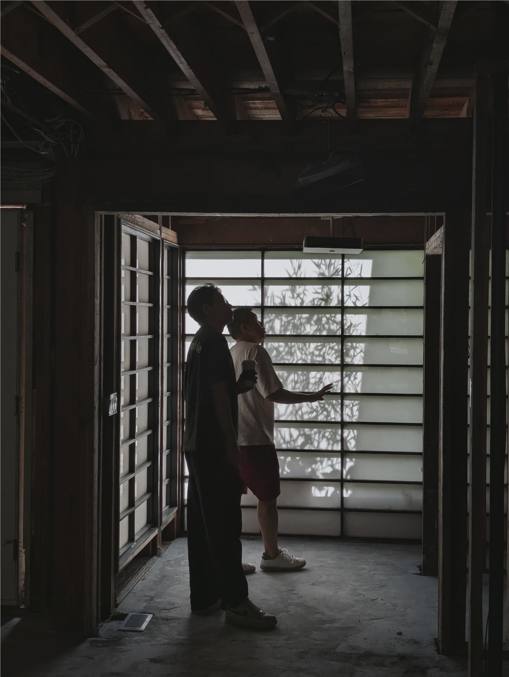Project team reviewing site conditions inside a home under construction