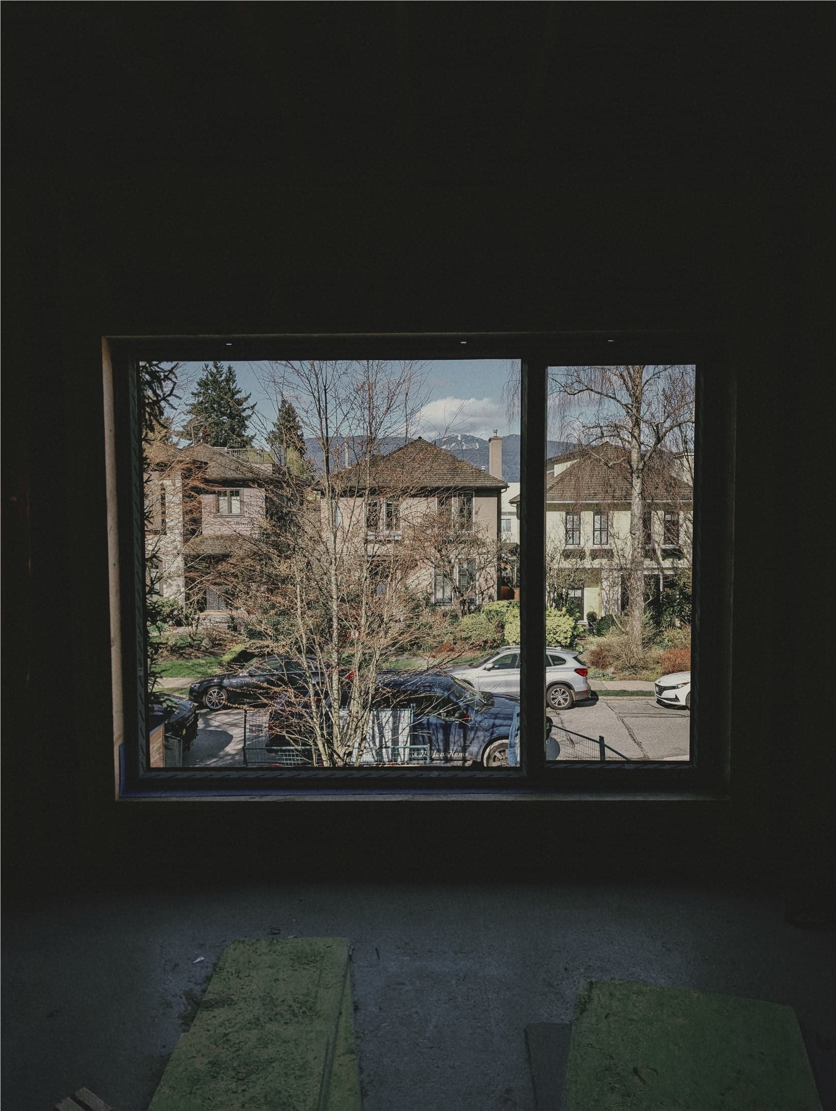 Window installation view from inside a residential construction site