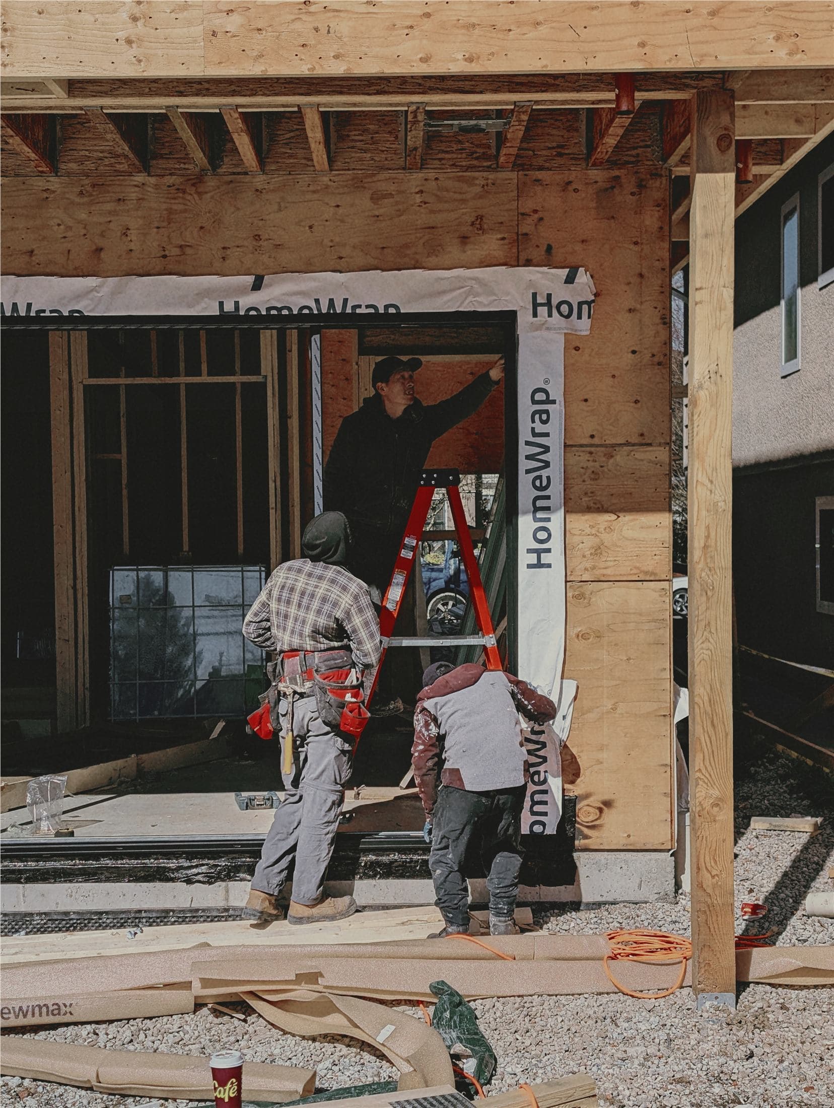 Installation team working at a residential window opening