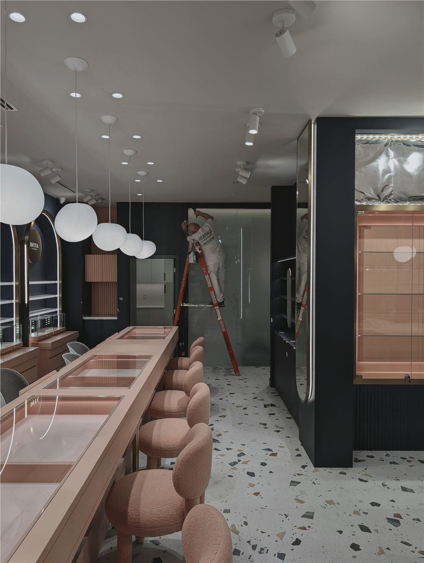 Retail interior installation in progress with display fixtures and lighting