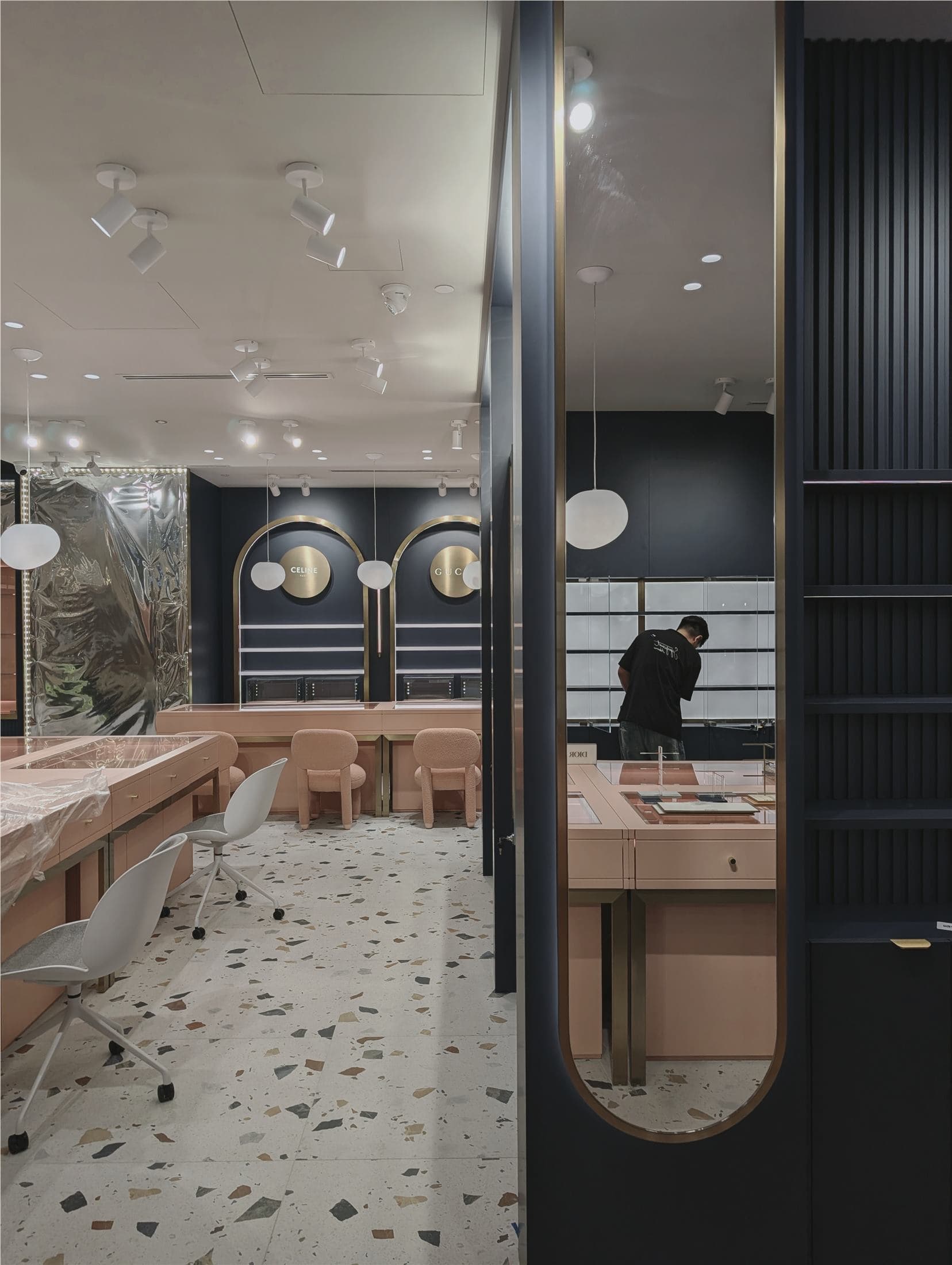 Retail interior installation in progress with display fixtures and lighting